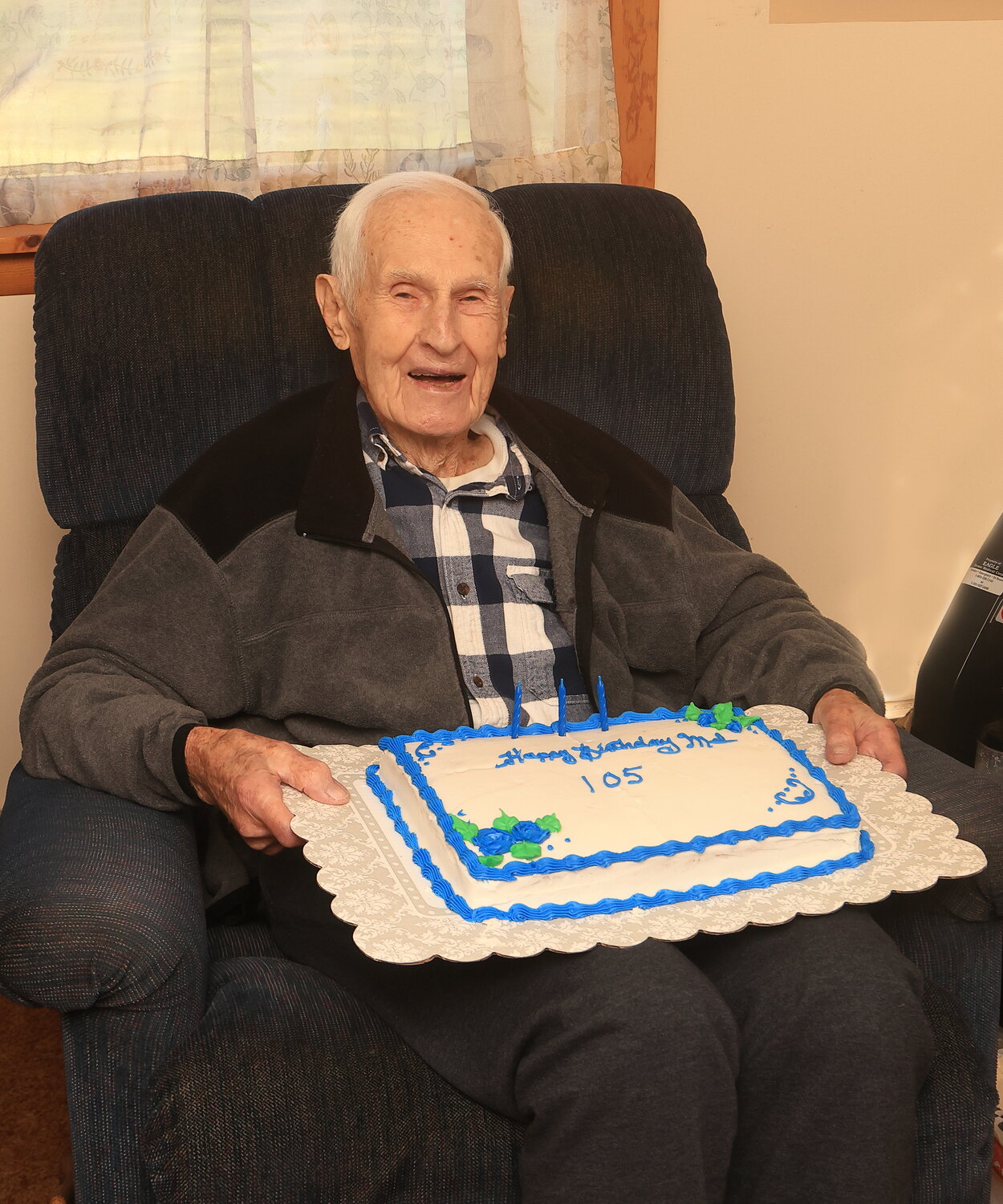 Mel Baker celebrates turning 105 with cake at Smith Hill Methodist Church.